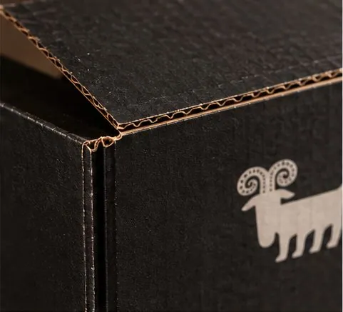 Close-up of the shipper corner showing black board and a single sheep.