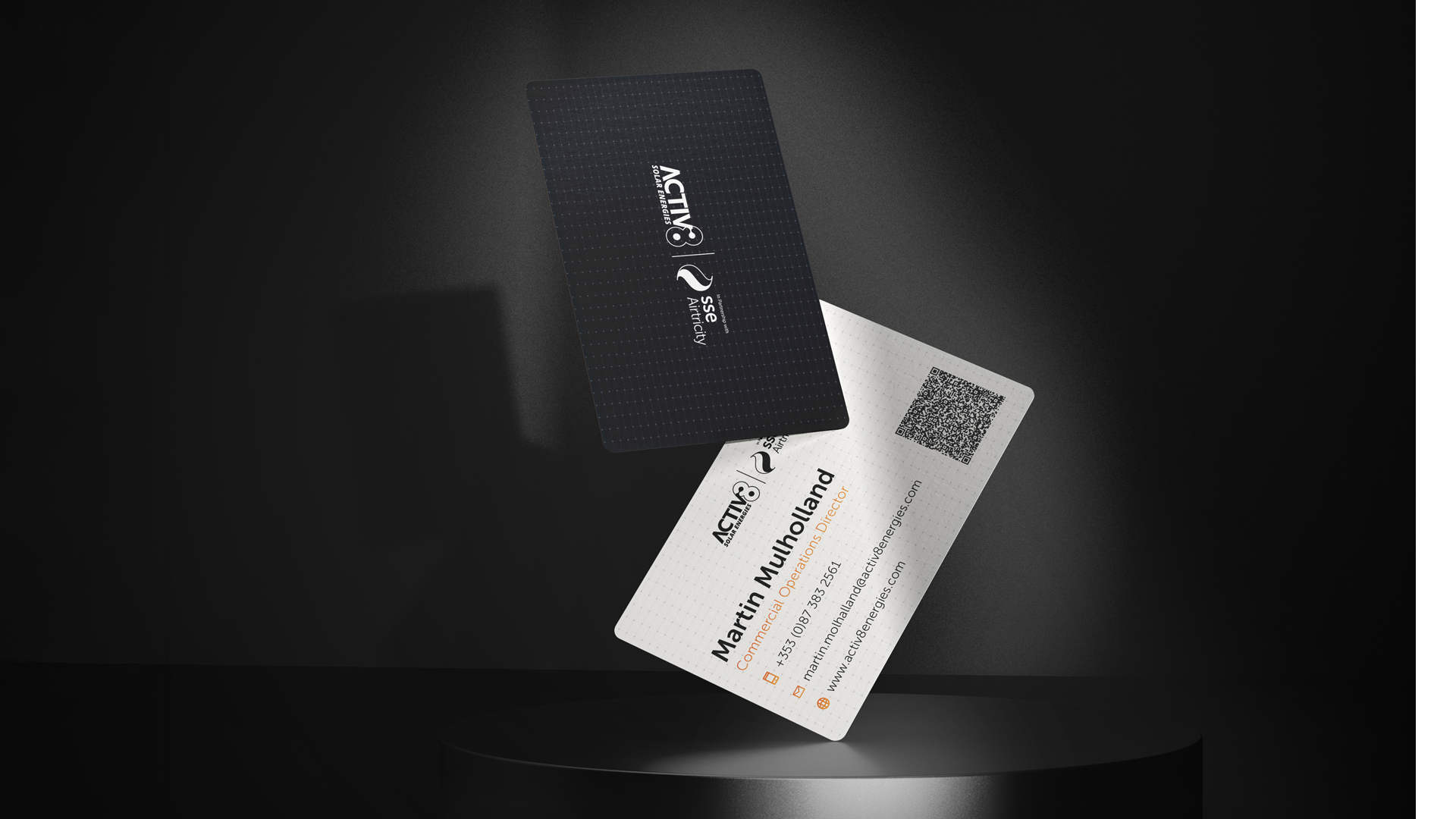 Front and back of the commercial business card, showing the black textured Activ8 x SSE Airtricity lock-up and Martin Mulholland's Commercial Operations Director details