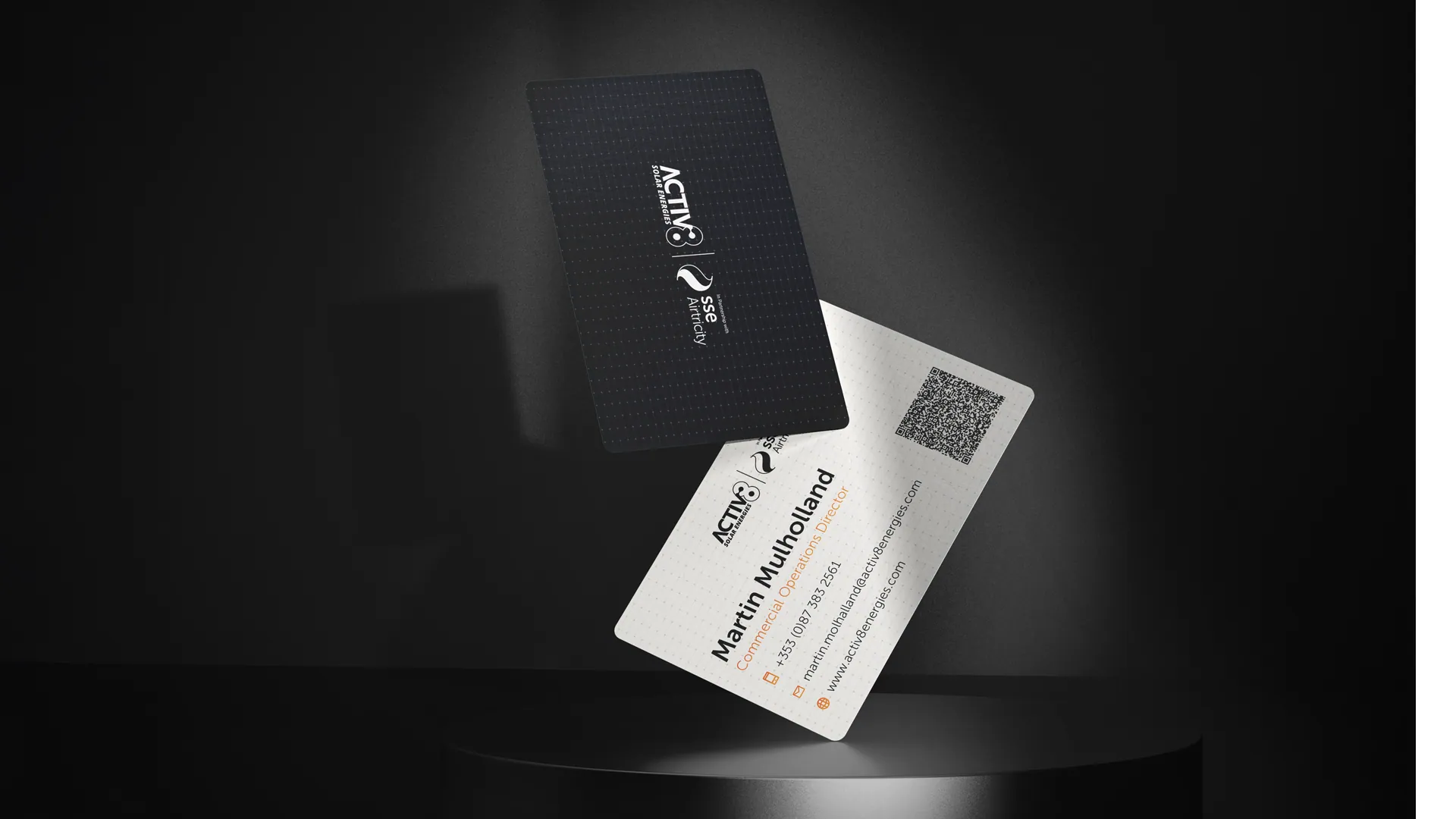 Front and back of the commercial business card, showing the black textured Activ8 x SSE Airtricity lock-up and Martin Mulholland's Commercial Operations Director details