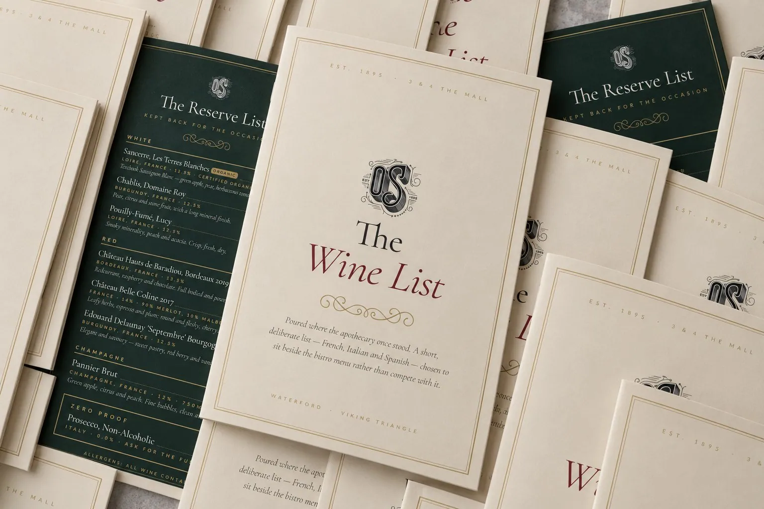 A print run of O'Sullivans wine lists and reserve lists laid out together on a stone surface